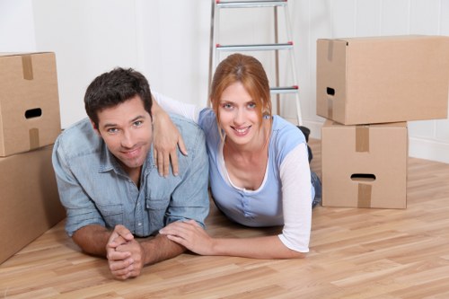 Professional movers carrying items during a Canonbury removal