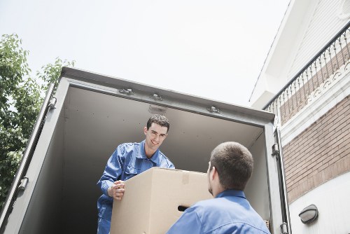 Professional movers handling furniture for a Canonbury home move